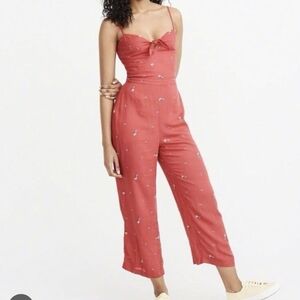 Elegant Coral Jumpsuit with Floral Accents
